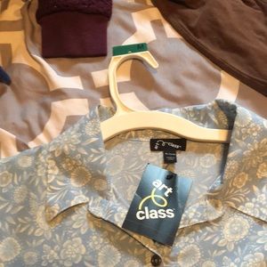 Light blue romper with various flower details.